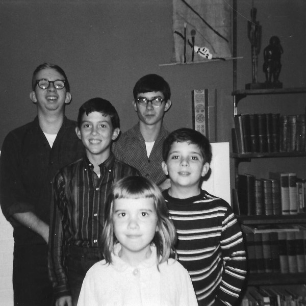 All the kids in front of the fireplace