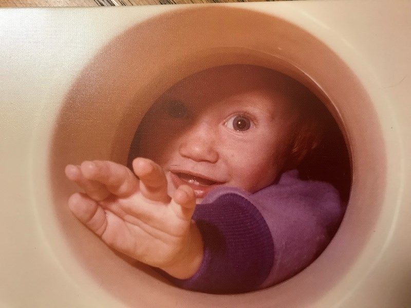 Patrick looking through a hole