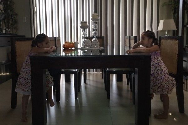 Alba in double exposure at dining room table