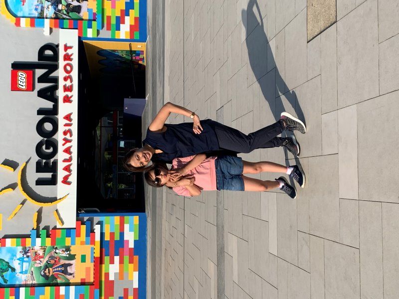 Cher and Alba in front of the Legoland Malaysia sign