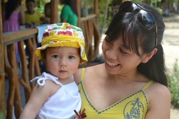 Cher holding 1 year old Alba at a summer outing